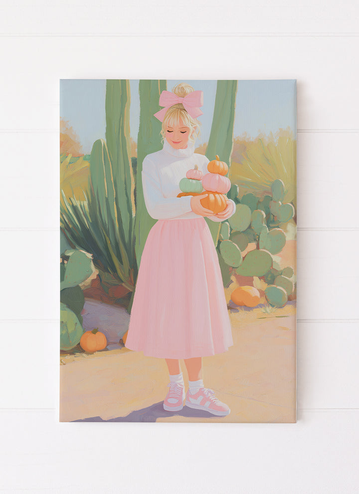 Girl in Pink Skirt Holding Pumpkins with Cactus Background