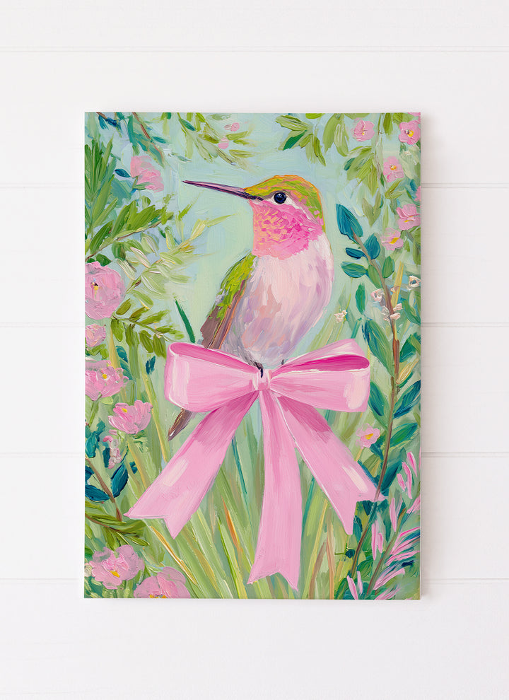 Humming Bird in Foliage with Pink Bow